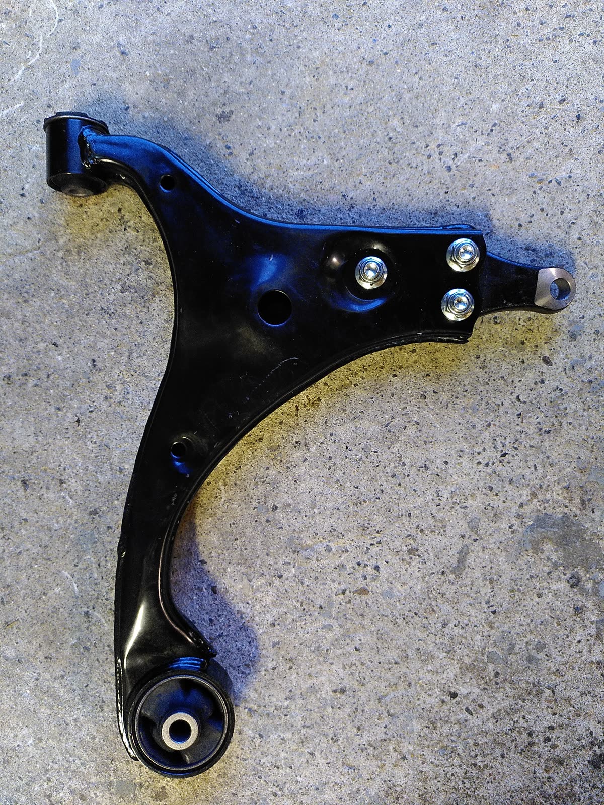 A lower control arm (lowering arm) suspension part